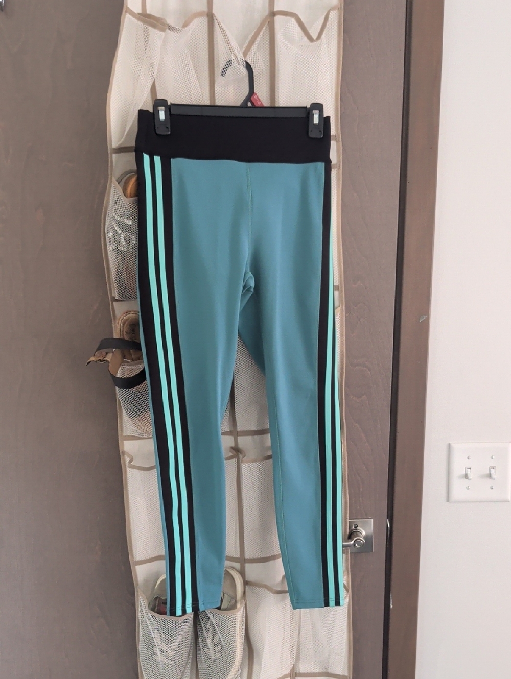 POP Fit Black Activewear Leggings with Teal And Black Stripe.